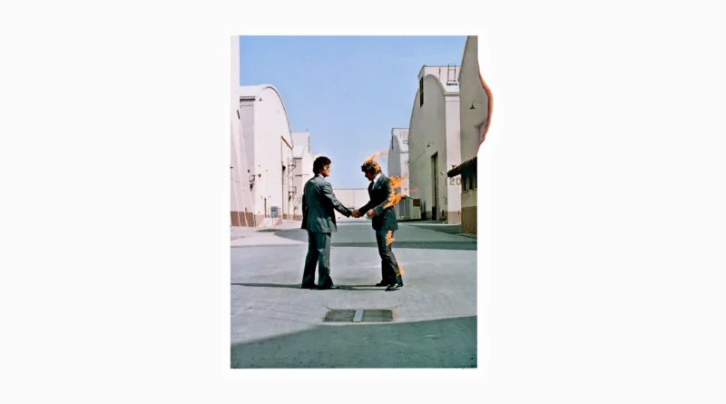 Portada del álbum Wish You Were Here de Pink Floyd con dos hombres dándose la mano mientras uno está en llamas.